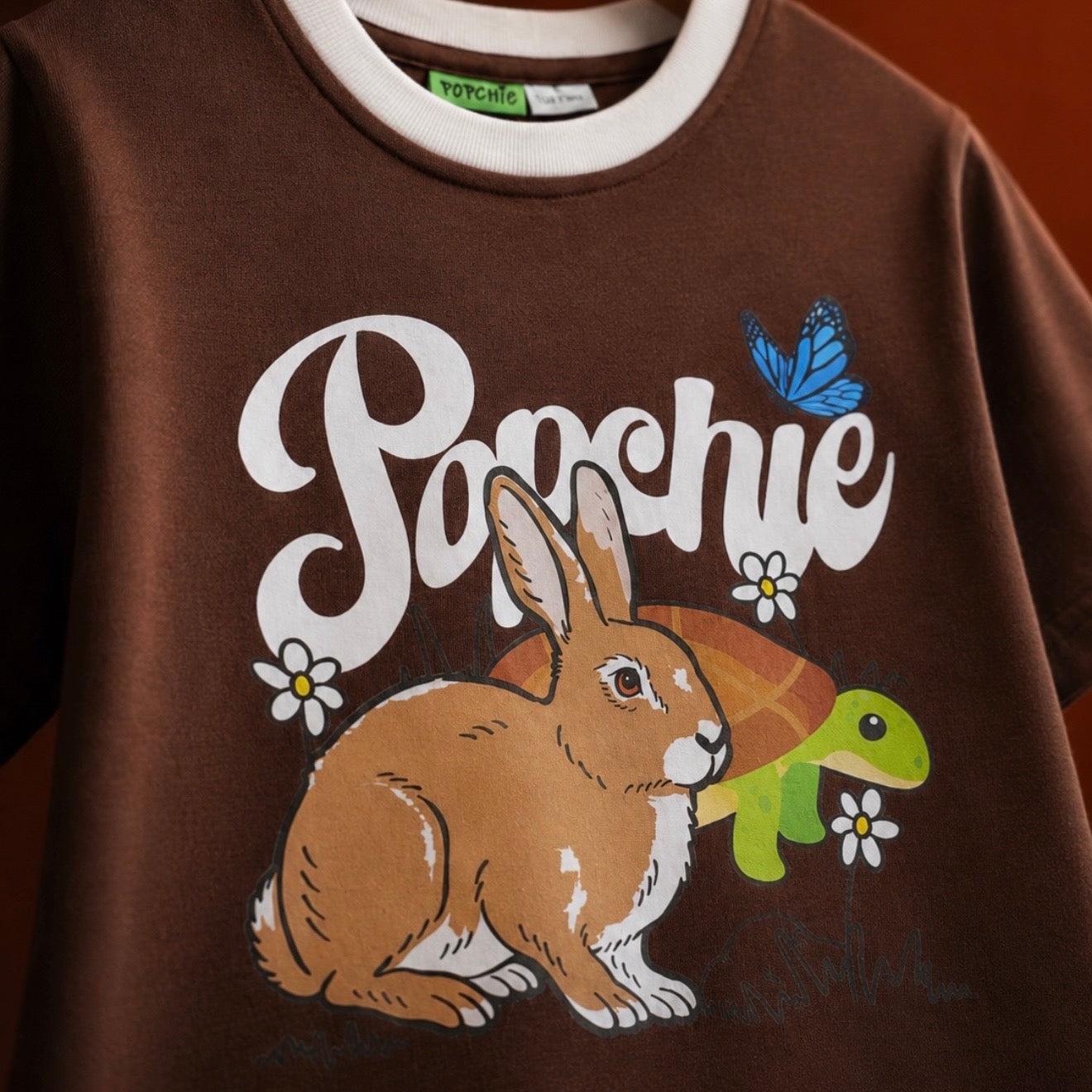 Popchie Rabbit 🐇 And Turtle 🐢 Races Brown Tee